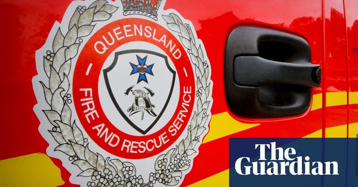 Queensland fire crews work to rescue man in his 80s stuck up to his neck in silo of fertiliser | Australia news